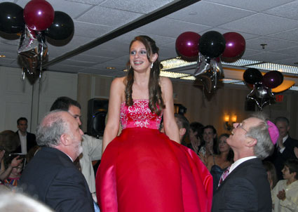 Jennifer gets hoisted in a chair - click to see more photos