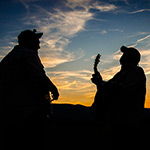 Zach Mongan and Sav Sankaran jam at The Foxhole at sunset. Photo by Stephen Ide